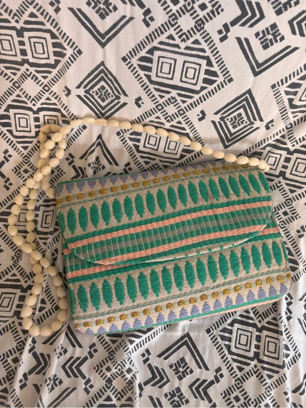 Green Patterned Woven Clutch w a shoulder Strap, button closure,fabric exterior